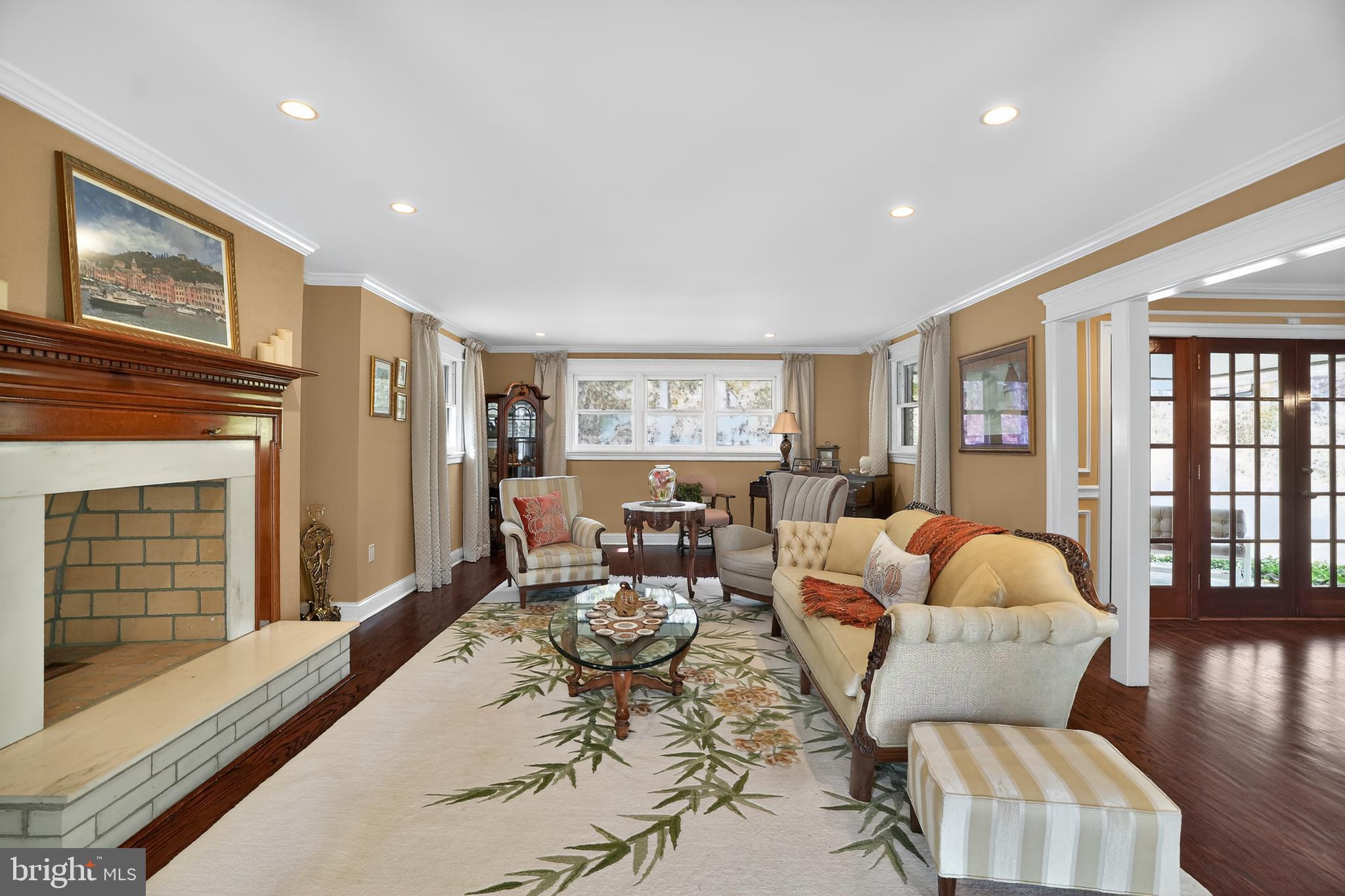1013 Glen Road Wallingford, PA 19086 - Photo 18 of 45 a living room with furniture large window and wooden floor