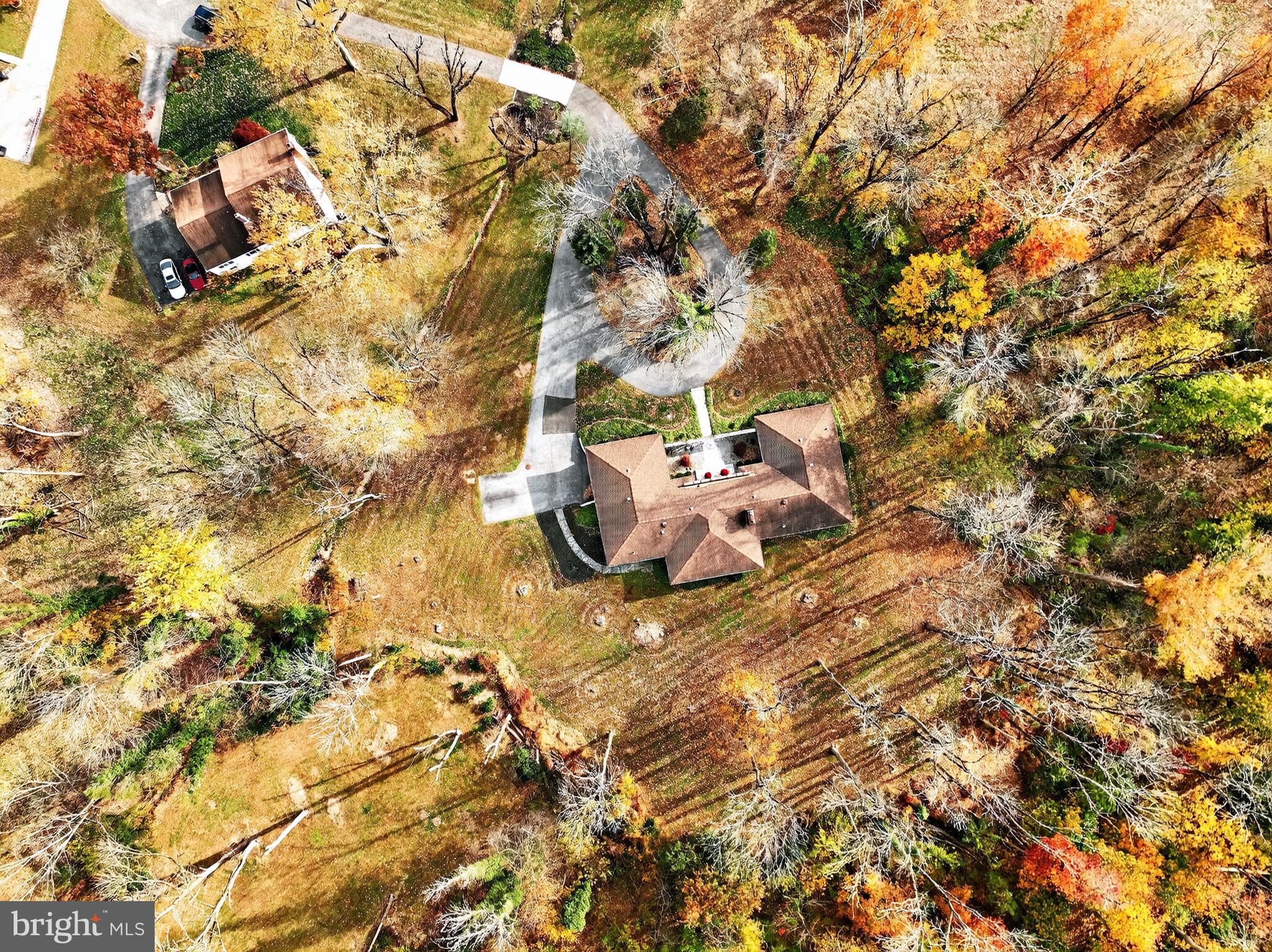 1013 Glen Road Wallingford, PA 19086 - Photo 3 of 45 a backyard of a house with table and chairs under an umbrella
