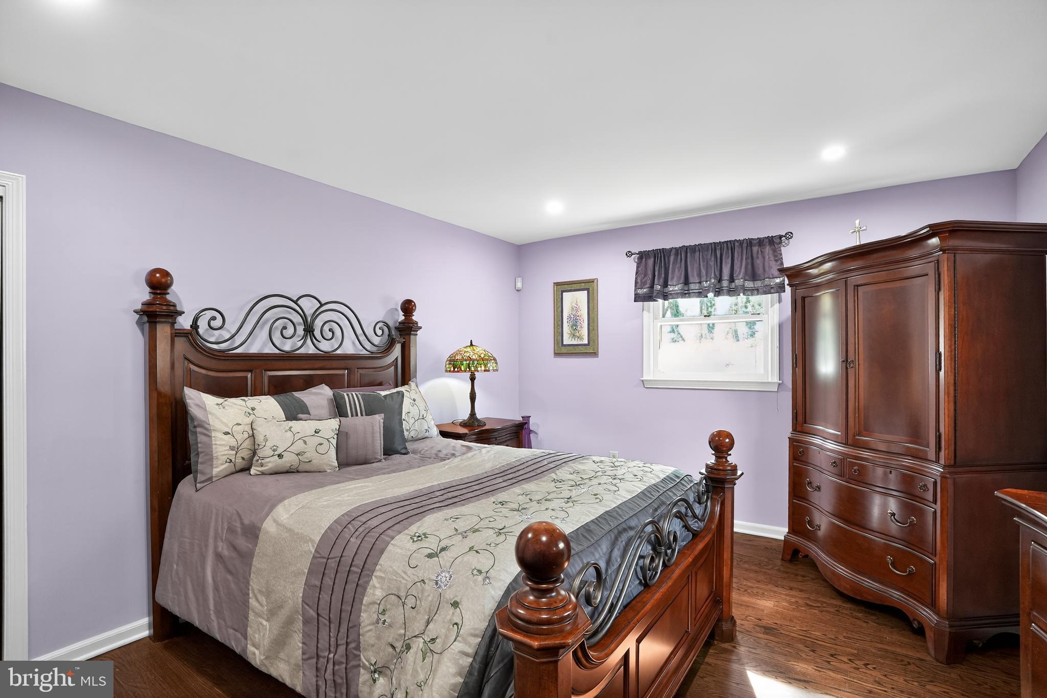 1013 Glen Road Wallingford, PA 19086 - Photo 32 of 45 a bedroom with a bed and a refrigerator