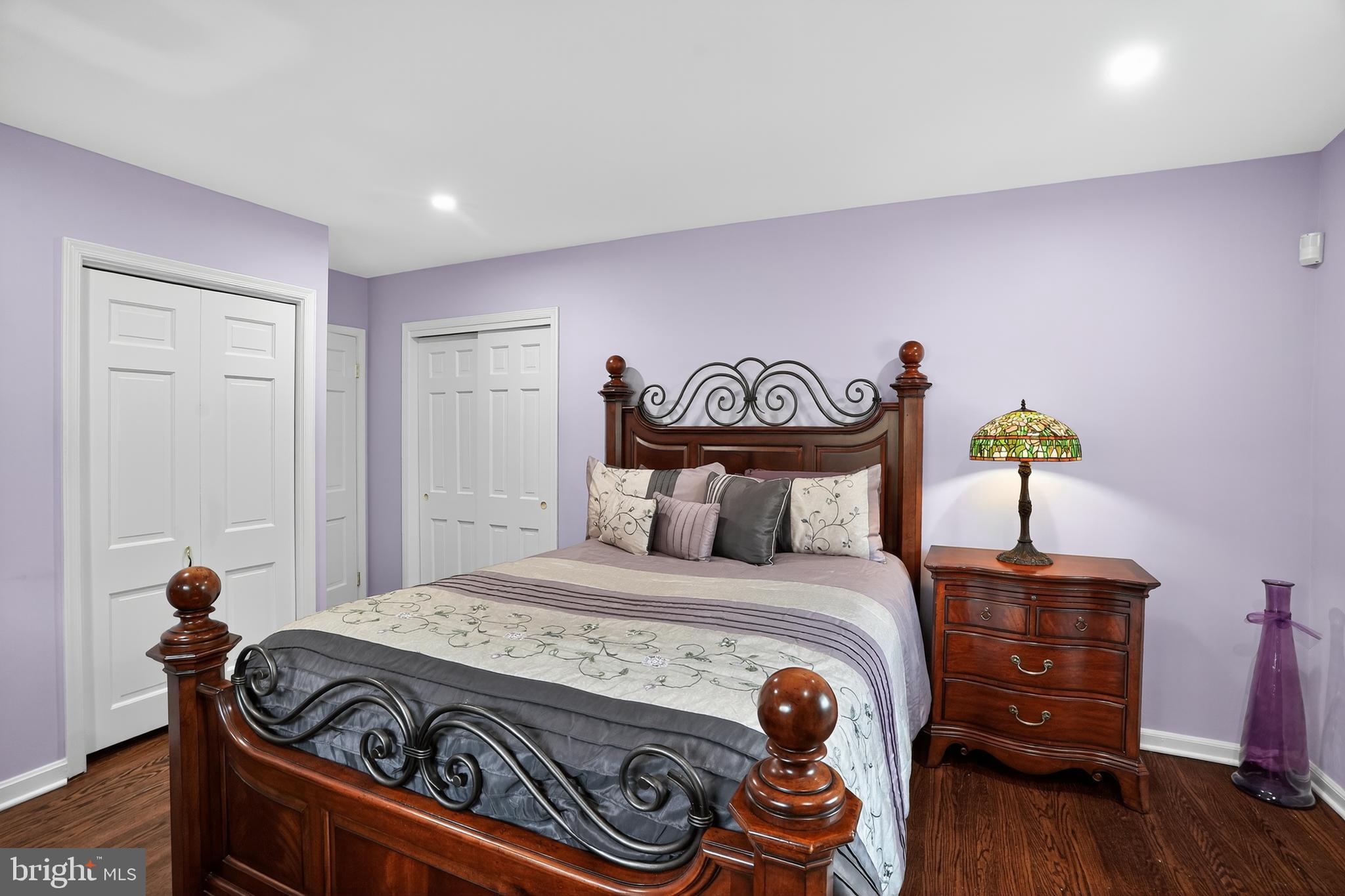 1013 Glen Road Wallingford, PA 19086 - Photo 35 of 45 a bedroom with a bed and wooden floor