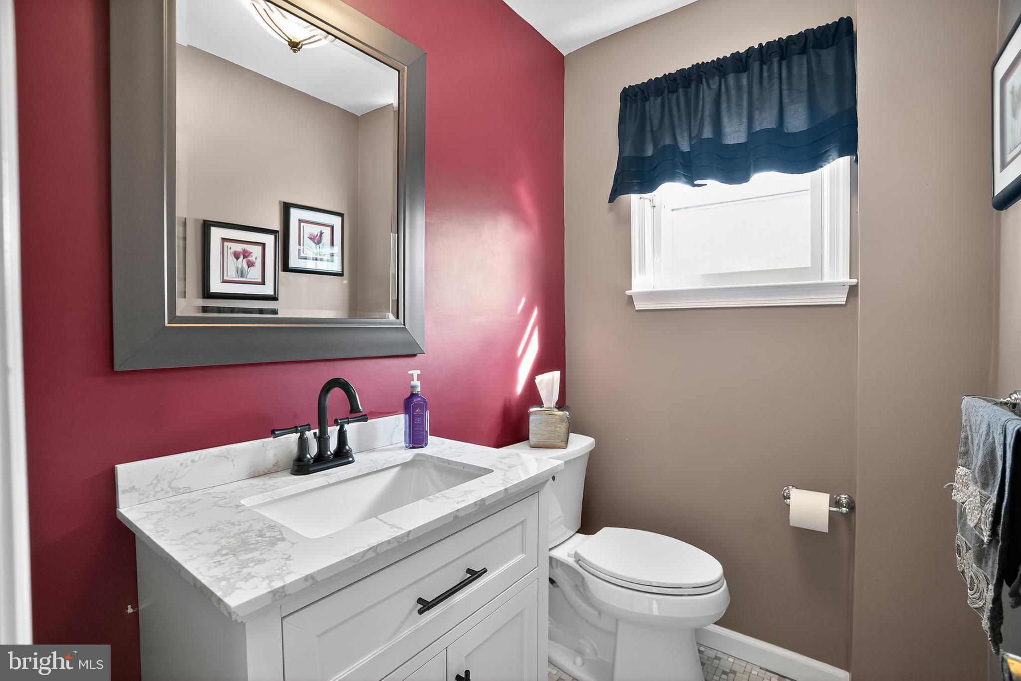 1013 Glen Road Wallingford, PA 19086 - Photo 39 of 45 a bathroom with a toilet sink and mirror