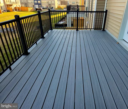 a view of balcony with wooden floor
