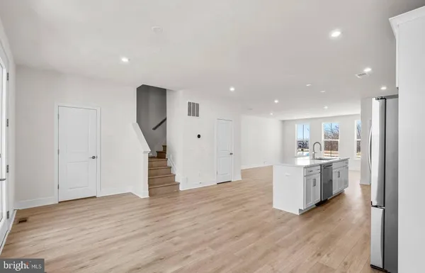a view of kitchen with sink microwave and stove