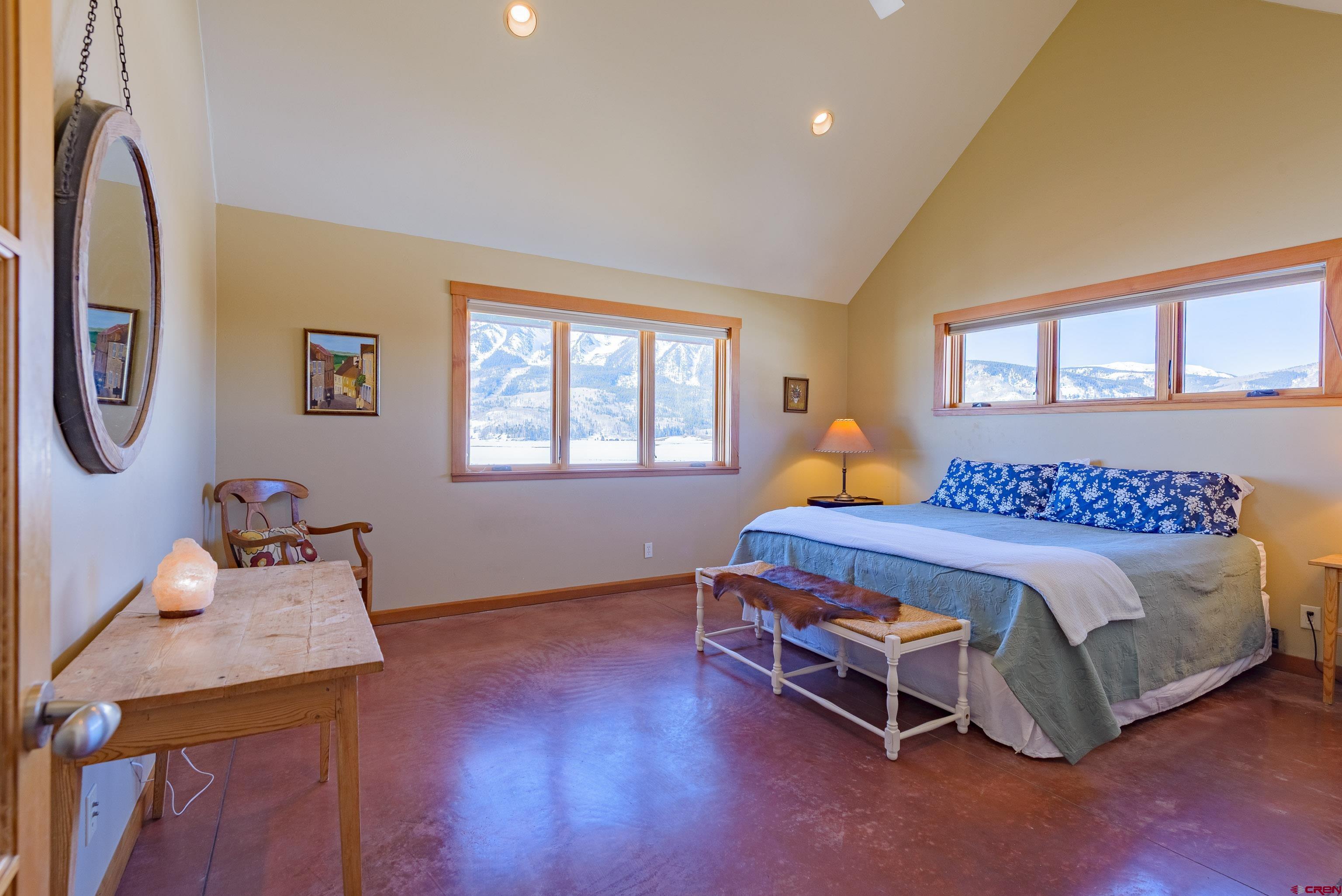 70 Bridle Spur Way Crested Butte, CO 81224 - Photo 14 of 42 a bedroom with a bed and a window