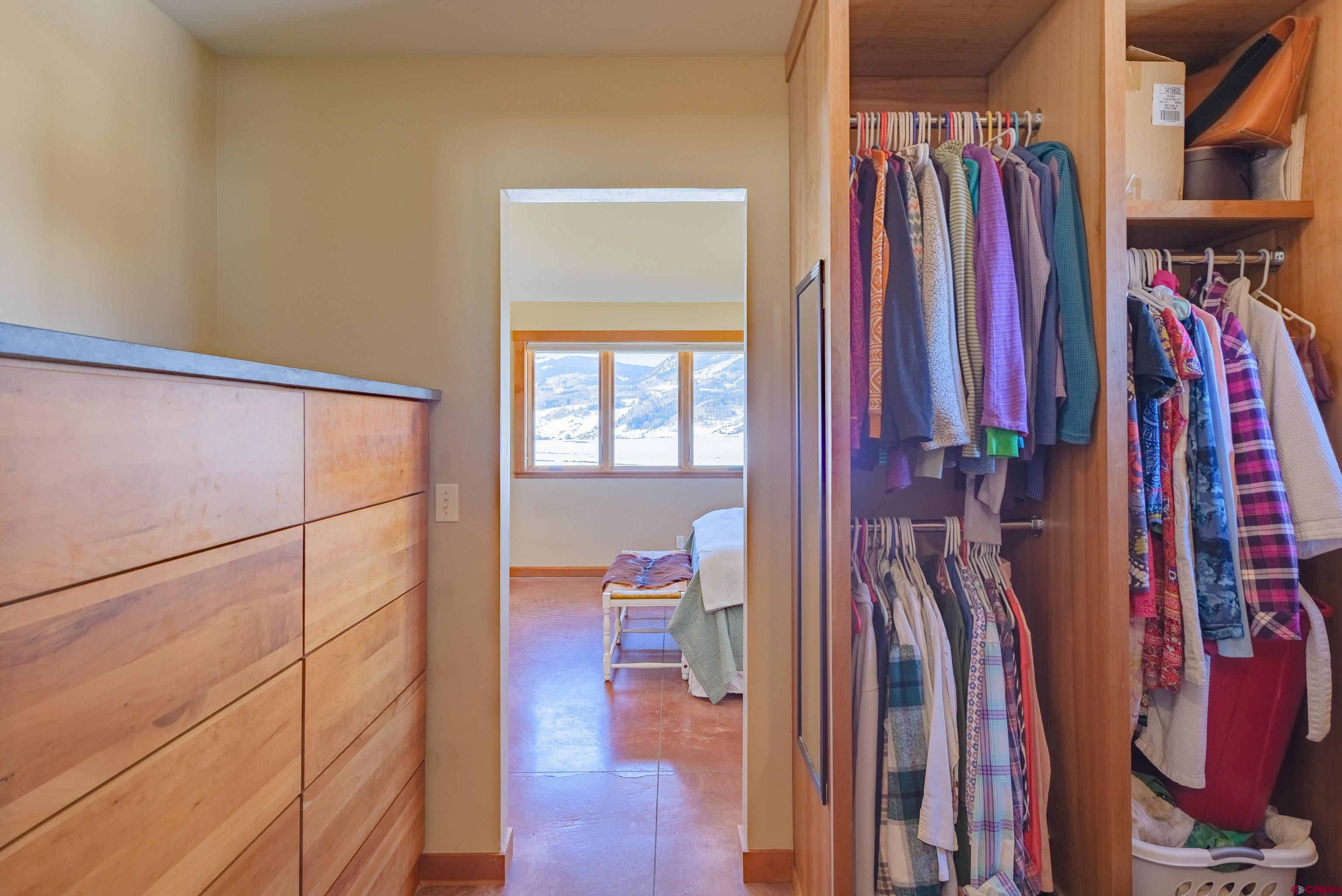 70 Bridle Spur Way Crested Butte, CO 81224 - Photo 17 of 42 a view of walk in closet with clothes and shoes
