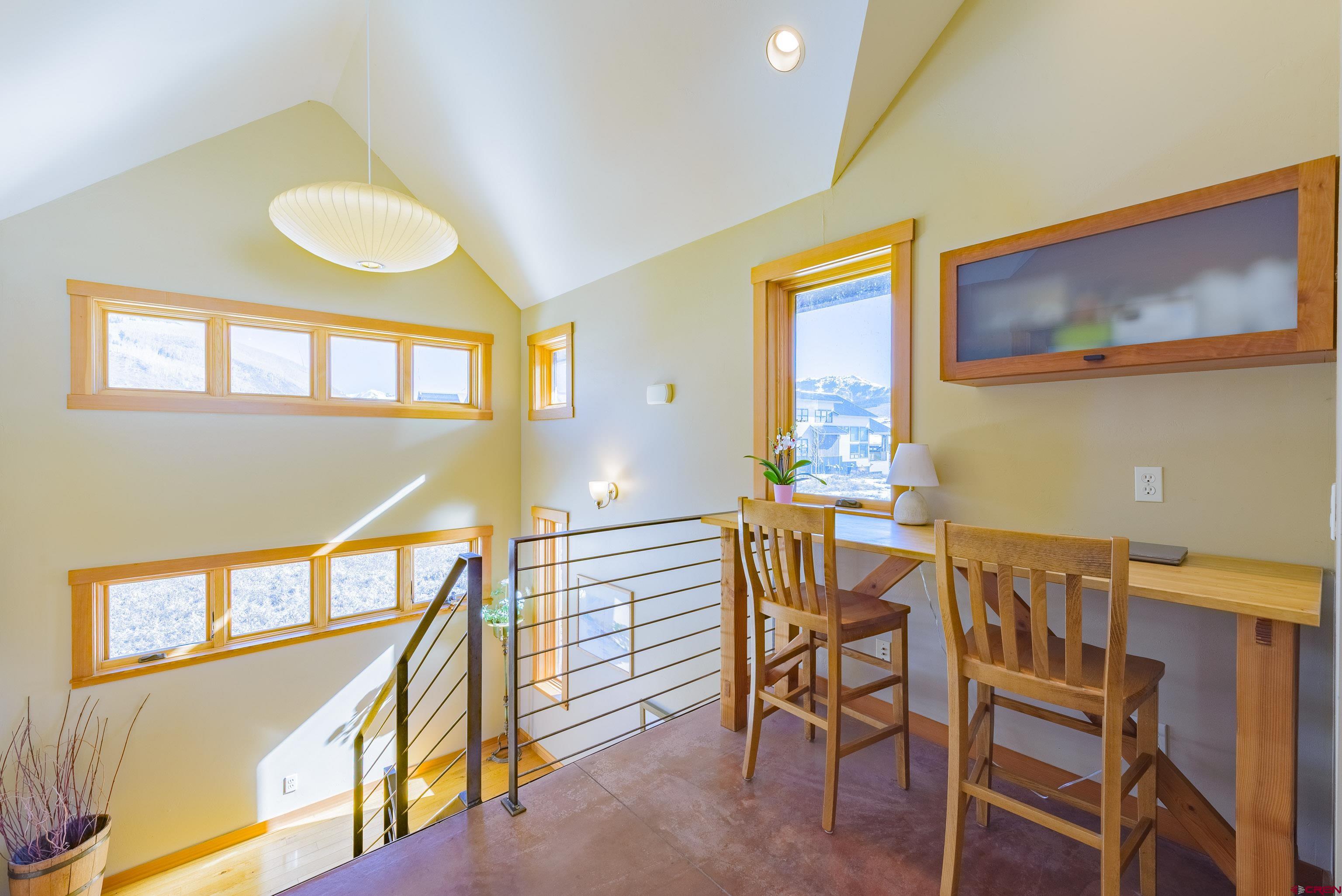 70 Bridle Spur Way Crested Butte, CO 81224 - Photo 18 of 42 a view of a dining room with furniture and a window