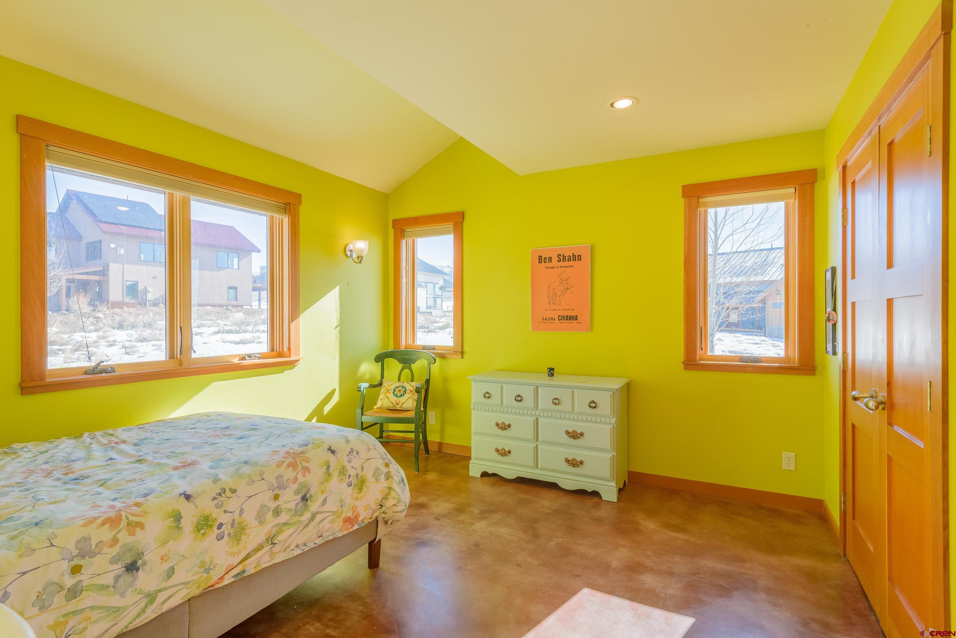 70 Bridle Spur Way Crested Butte, CO 81224 - Photo 19 of 42 a bedroom with a bed and windows