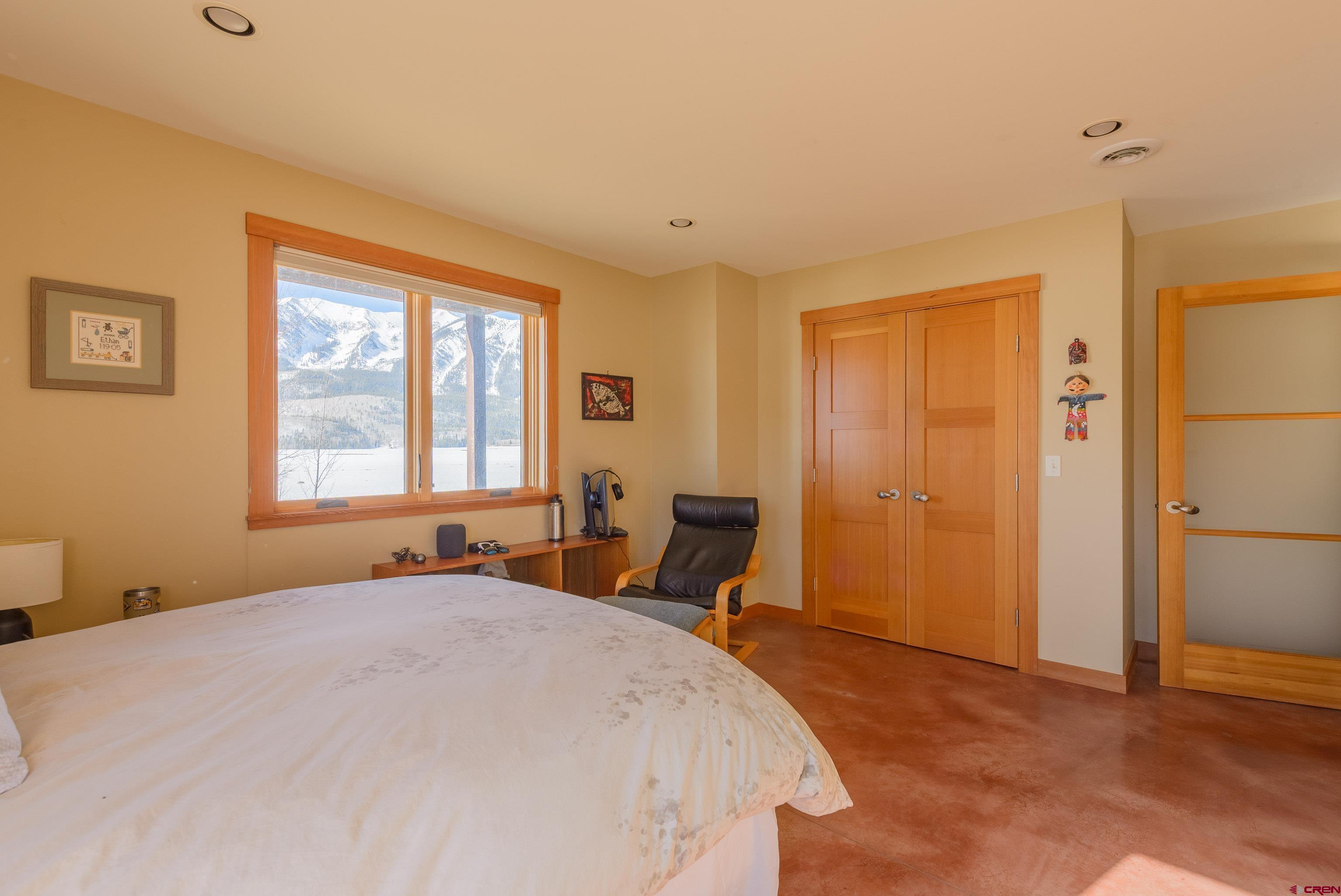 70 Bridle Spur Way Crested Butte, CO 81224 - Photo 24 of 42 a bedroom with a bed and a window