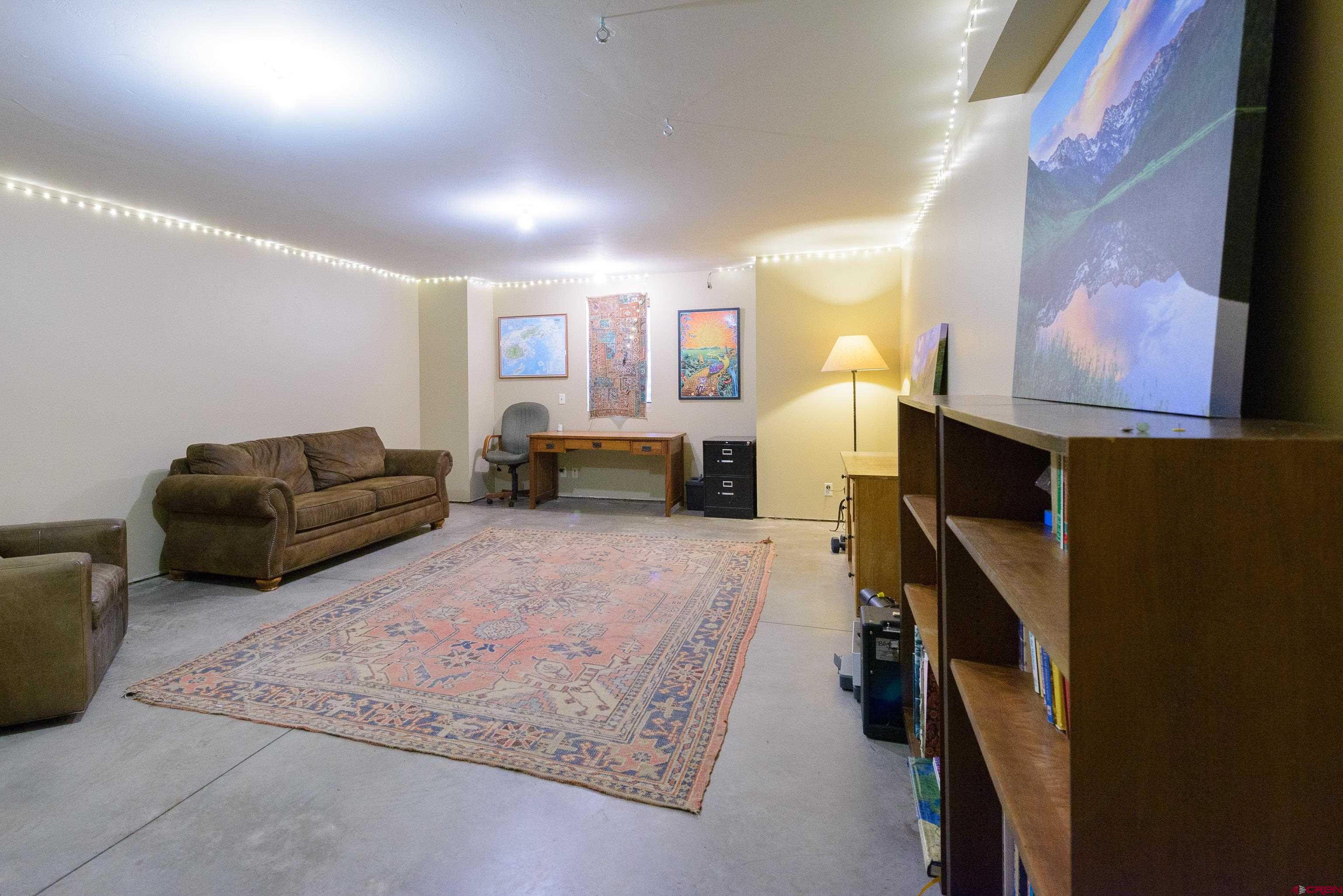 70 Bridle Spur Way Crested Butte, CO 81224 - Photo 25 of 42 a living room with furniture and a couch