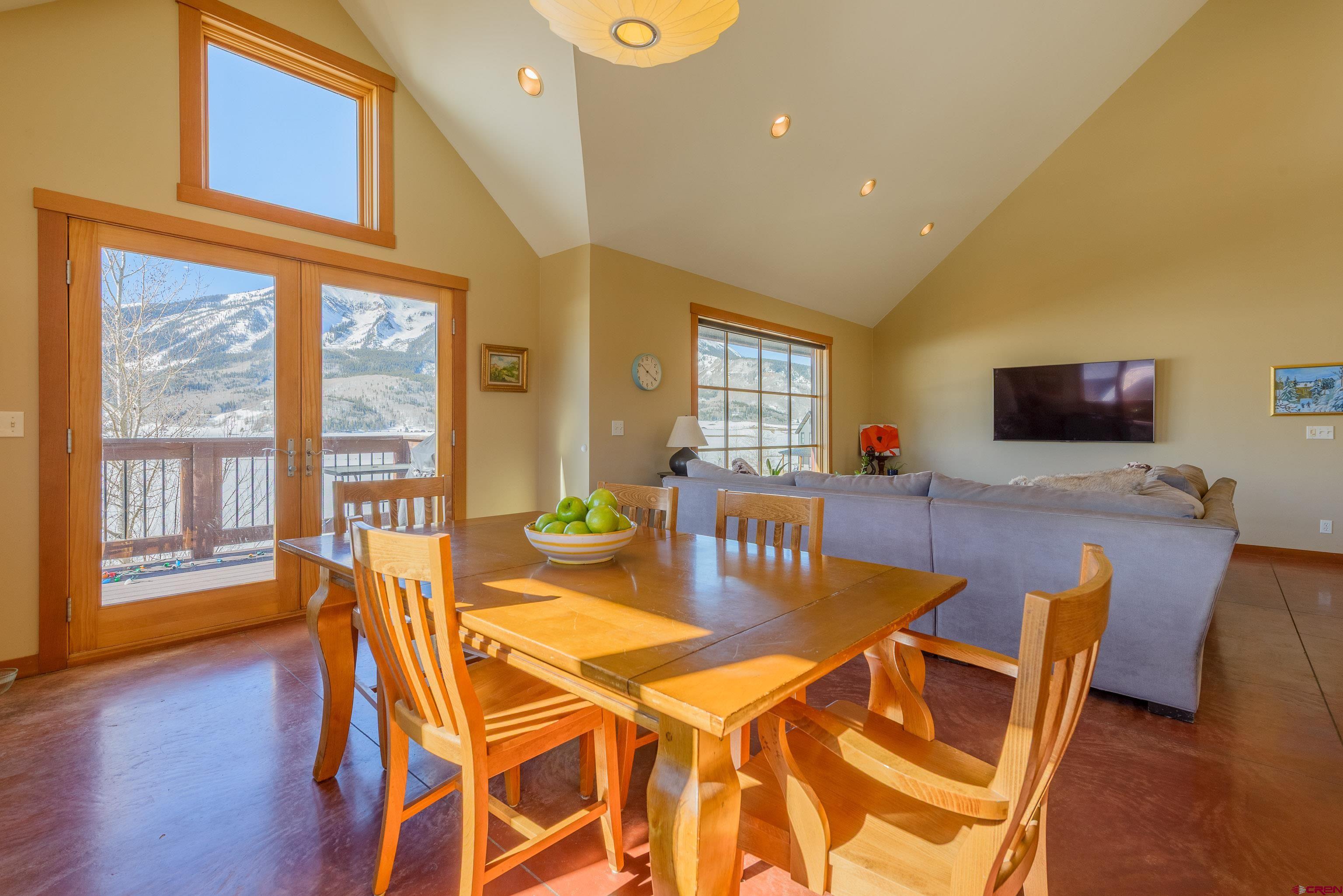 70 Bridle Spur Way Crested Butte, CO 81224 - Photo 7 of 42 a view of a dining room with furniture window and wooden floor