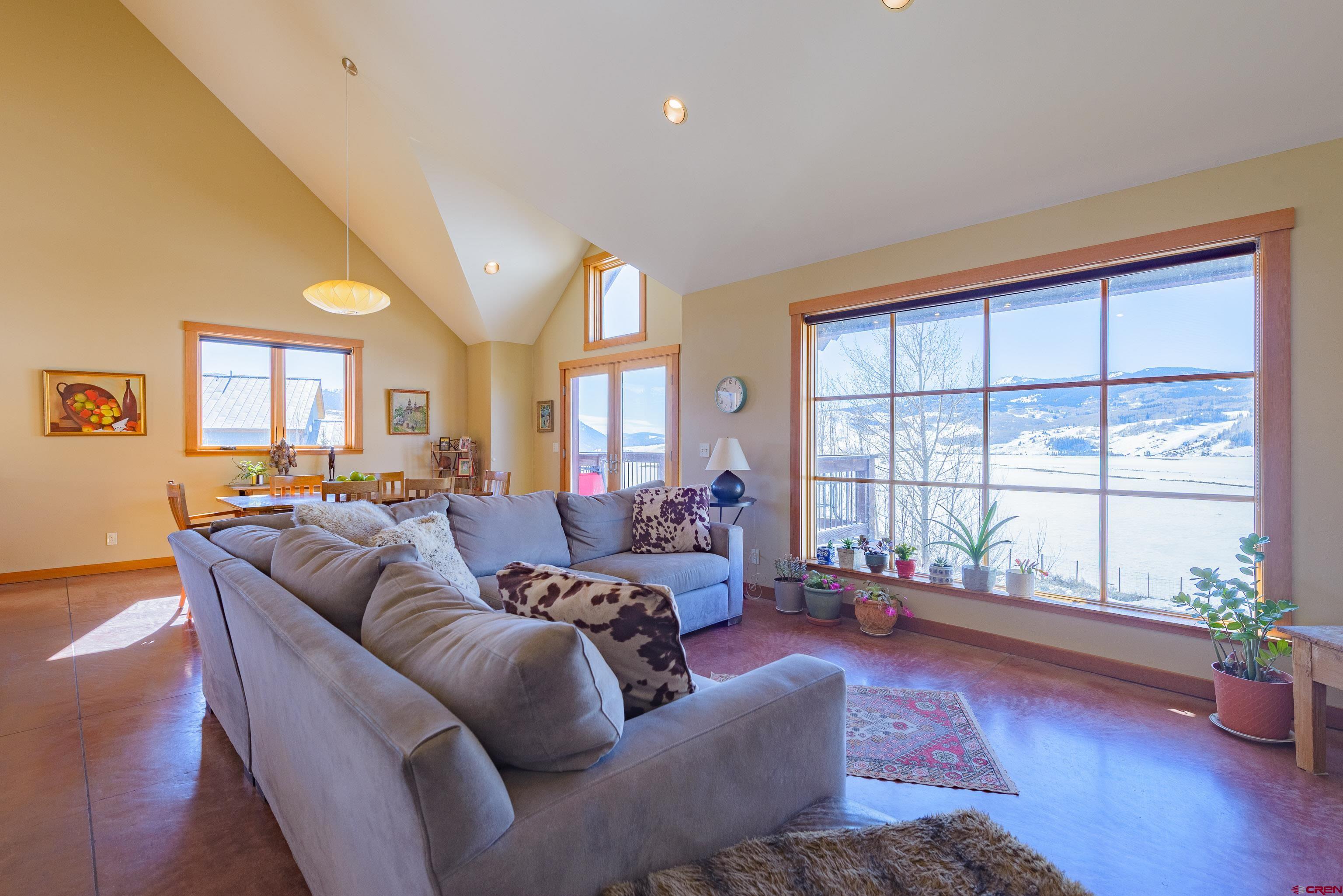 70 Bridle Spur Way Crested Butte, CO 81224 - Photo 8 of 42 a living room with furniture and a large window