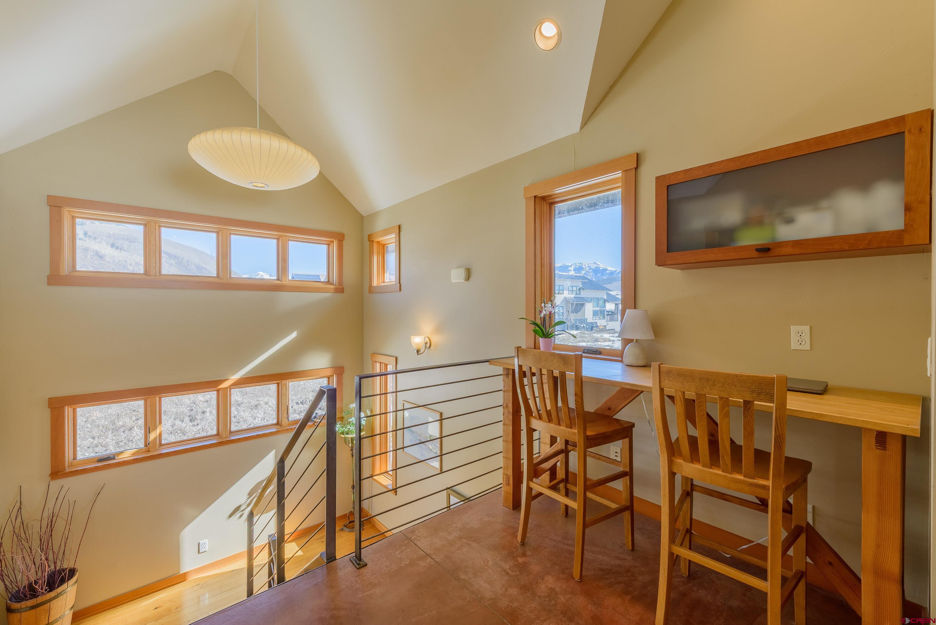 70 Bridle Spur Way Crested Butte, CO 81224 - Photo 10 of 42 a view of a dining room with furniture and a window