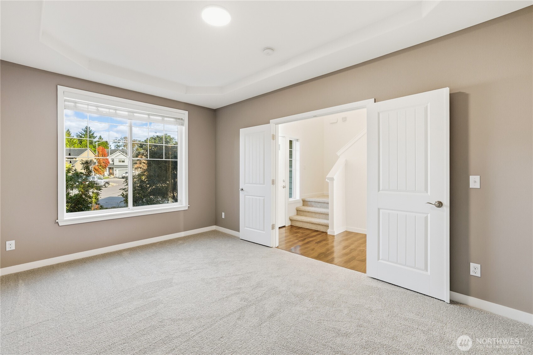 114 Ames Street Northeast Orting, WA 98360 - Photo 13 of 38 a view of an empty room with a window