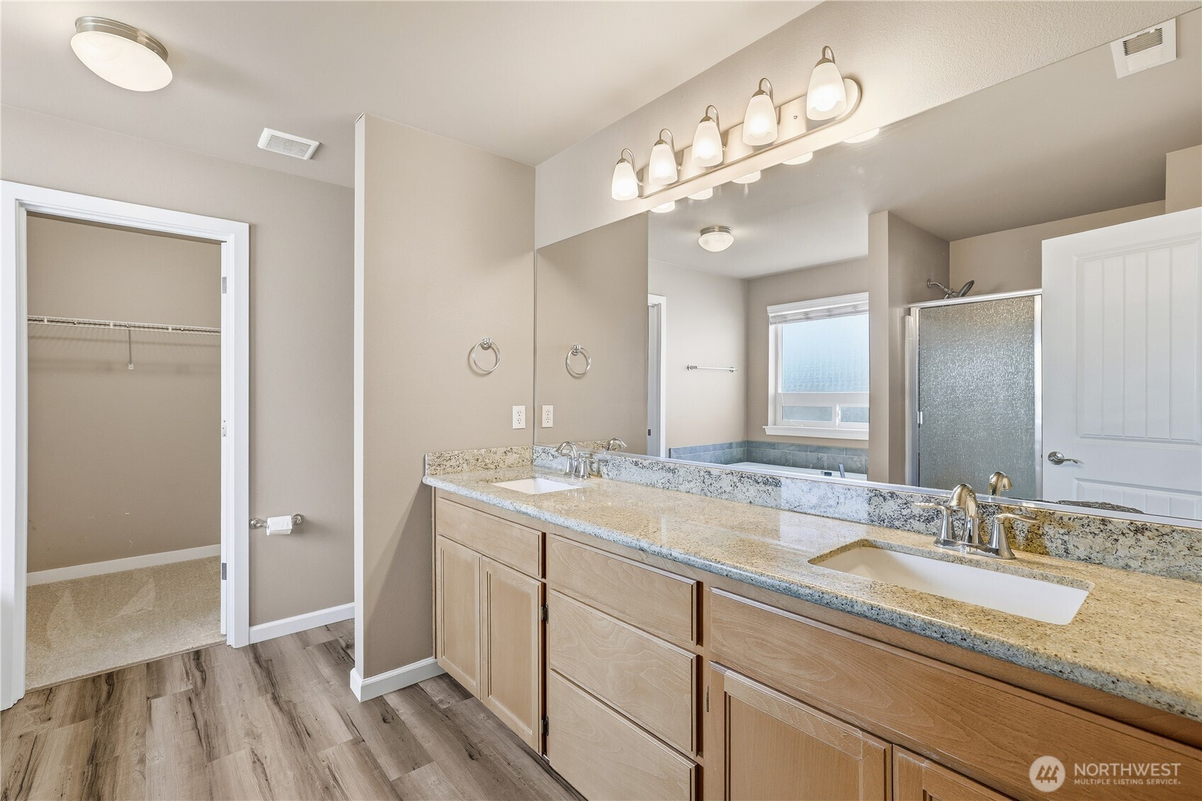114 Ames Street Northeast Orting, WA 98360 - Photo 17 of 38 a bathroom with a sink double vanity and a mirror