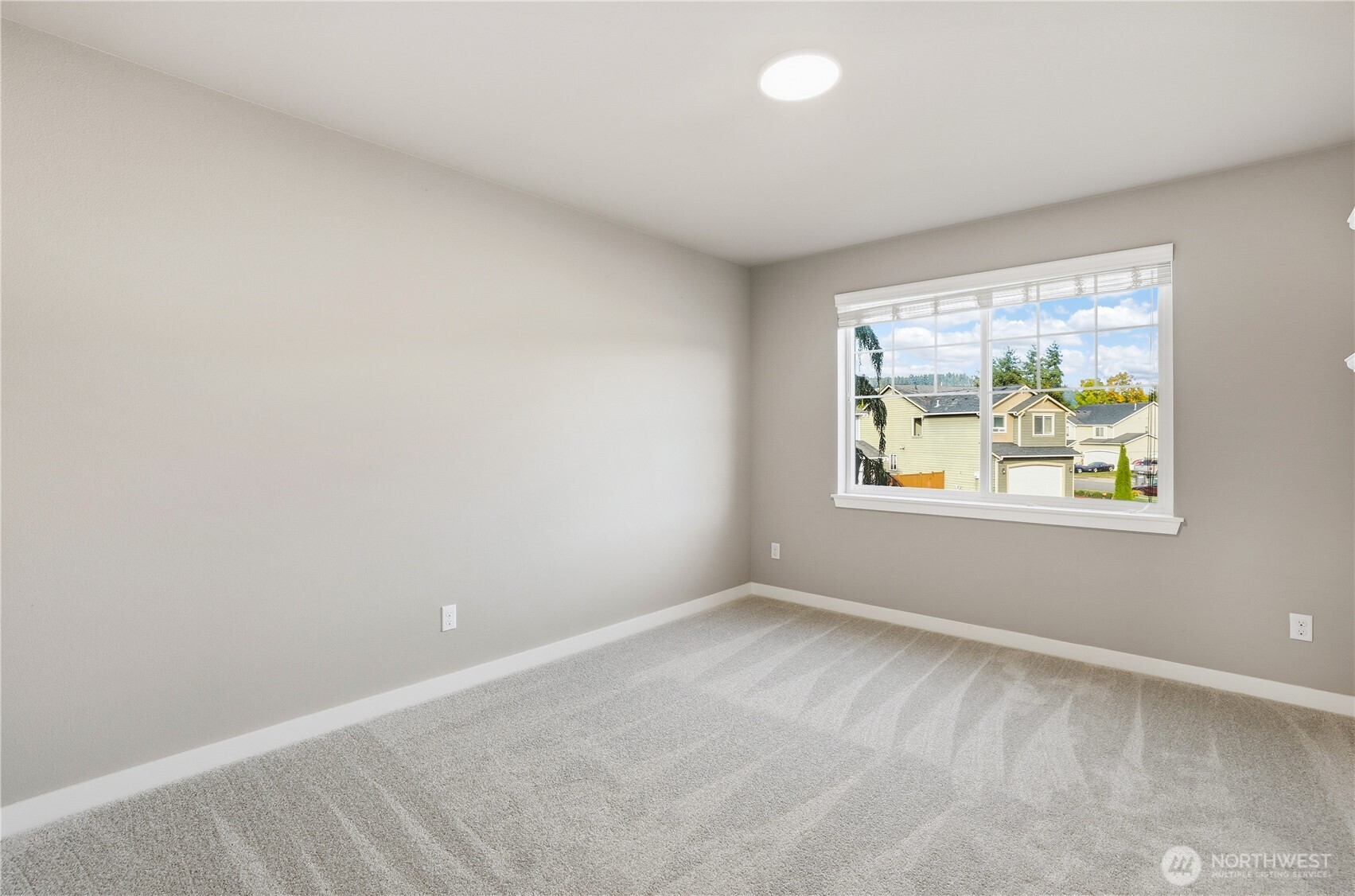 114 Ames Street Northeast Orting, WA 98360 - Photo 21 of 38 an empty room with windows