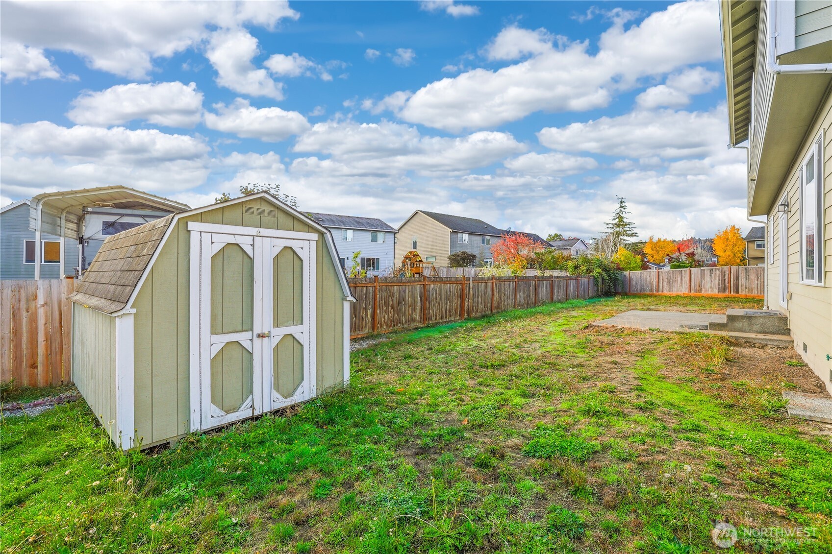 114 Ames Street Northeast Orting, WA 98360 - Photo 27 of 38 a view of a garden with tall buildings
