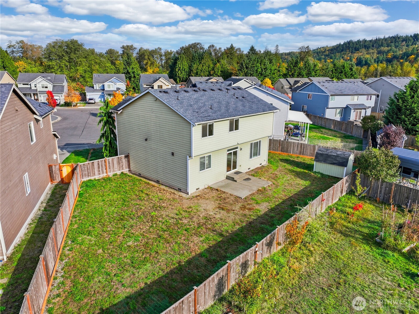 114 Ames Street Northeast Orting, WA 98360 - Photo 30 of 38 an aerial view of residential houses with outdoor space and trees