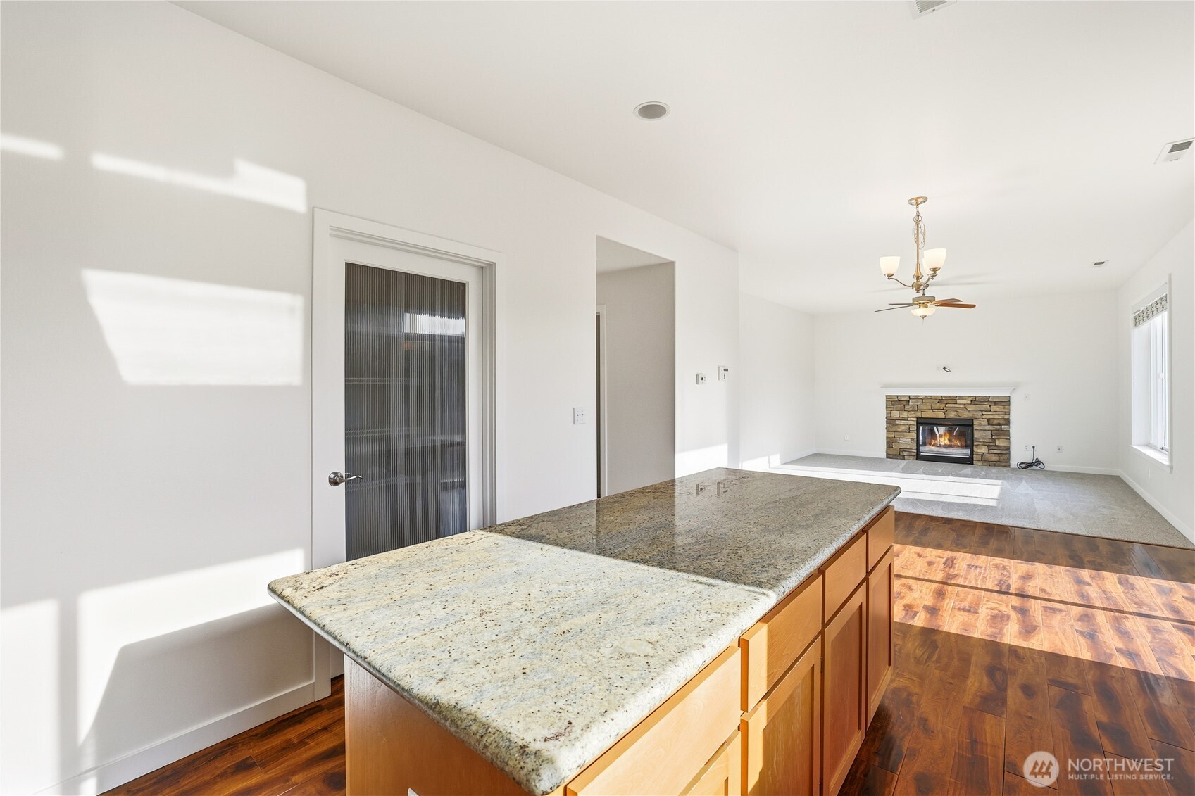 114 Ames Street Northeast Orting, WA 98360 - Photo 10 of 38 a kitchen with kitchen island a sink and a stove