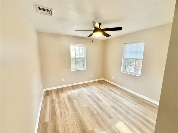 a view of a porch with wooden floor and outdoor space