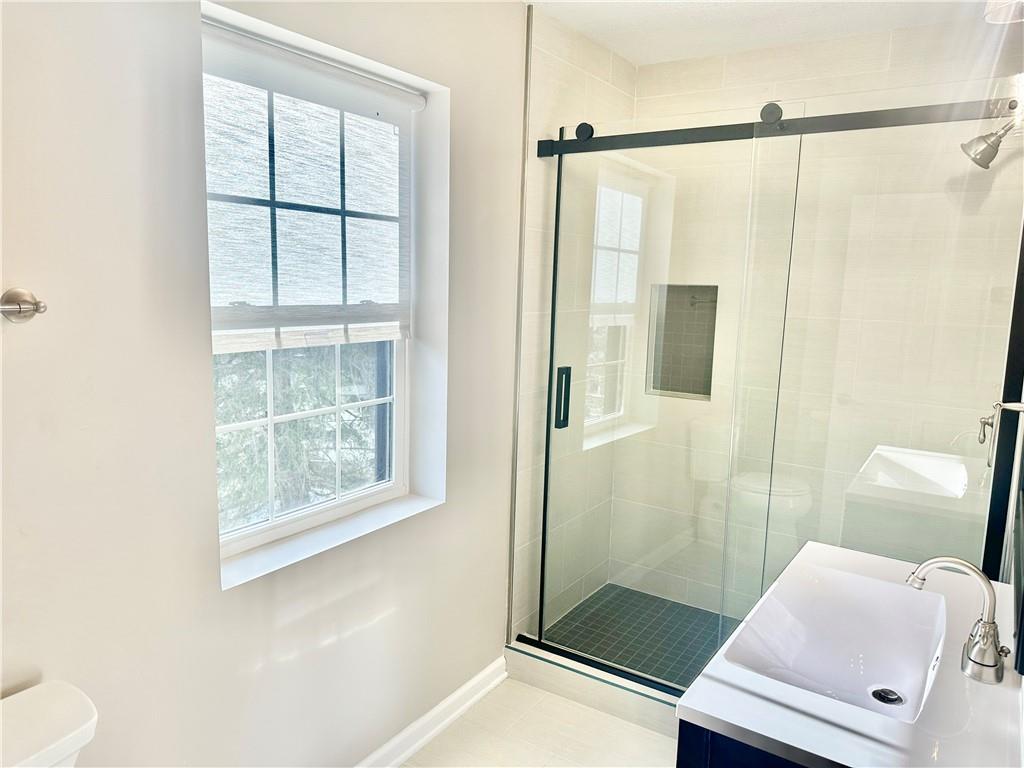 197 West Main Street, Unit 2 Uniontown, PA 15401 - Photo 4 of 13 a bathroom with a shower and a toilet