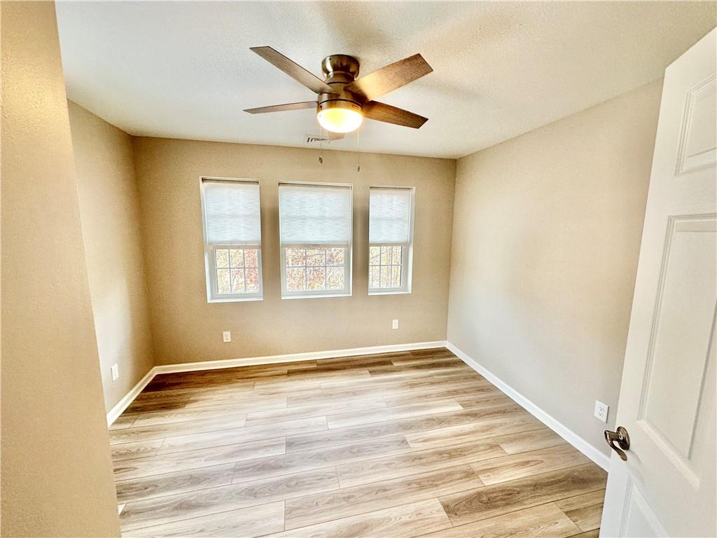 197 West Main Street, Unit 2 Uniontown, PA 15401 - Photo 10 of 13 a view of an empty room with wooden floor and a window