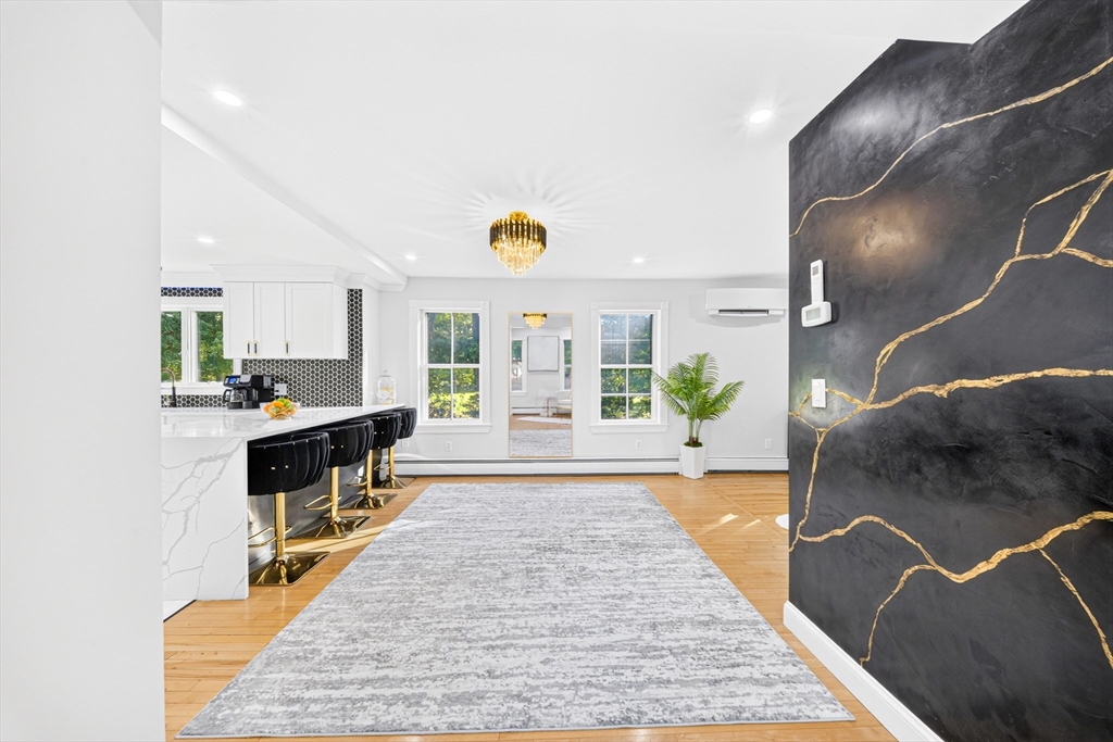 24 Miller Road Wilmington, MA 01887 - Photo 10 of 40 a lobby with furniture and wooden floor