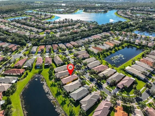 a view of a house with backyard sitting area and garden