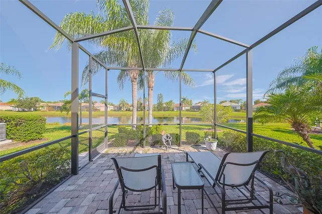a view of an chairs and table in the patio