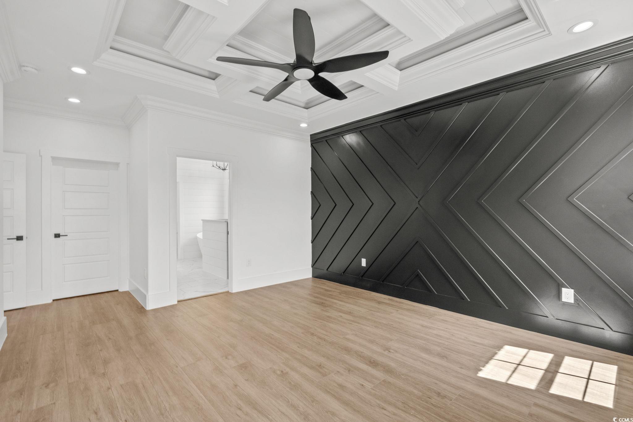 562 Linton Park Road Myrtle Beach, SC 29579 - Photo 29 of 40 Unfurnished living room with recessed lighting, coffered ceiling, light wood-style flooring, ceiling fan, and beam ceiling