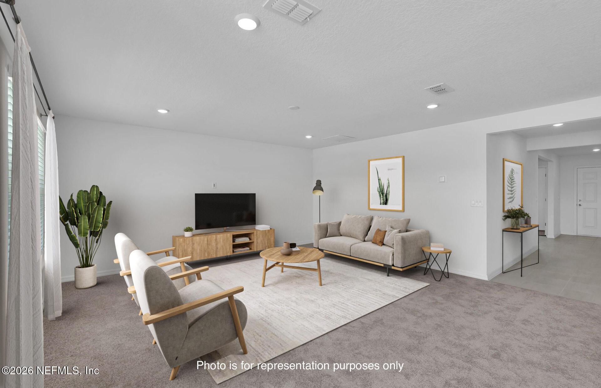 7022 Sandperch Street Jacksonville, FL 32244 - Photo 12 of 29 a living room with furniture and a flat screen tv