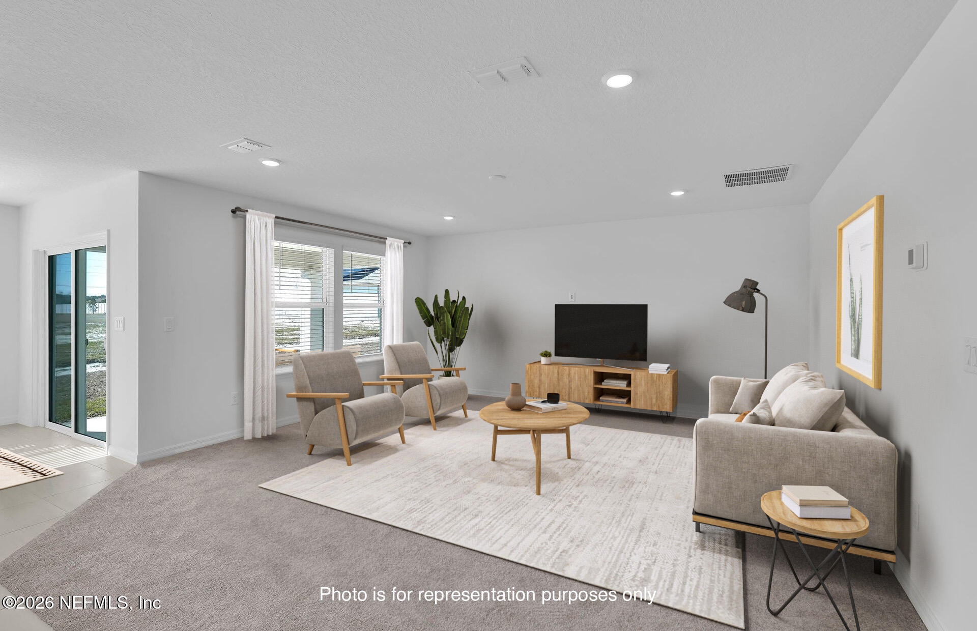 7022 Sandperch Street Jacksonville, FL 32244 - Photo 18 of 29 a living room with furniture and a flat screen tv