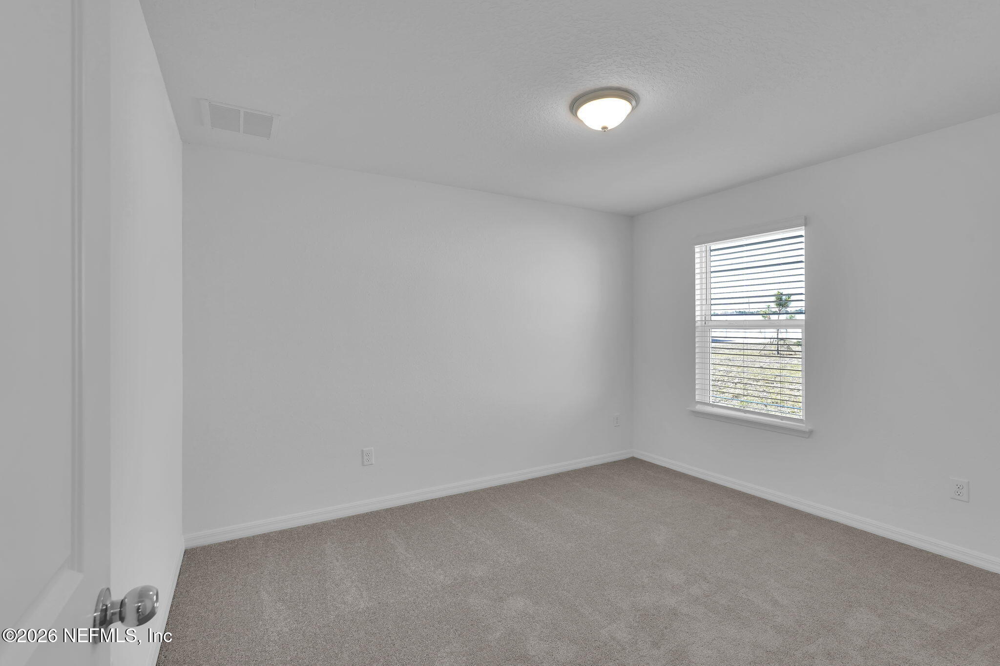 7022 Sandperch Street Jacksonville, FL 32244 - Photo 24 of 29 a view of an empty room with a window
