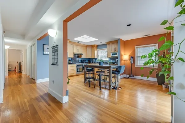 a view of a dining room with furniture and wooden floor