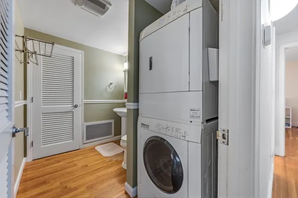 a view of a hallway with washer and dryer
