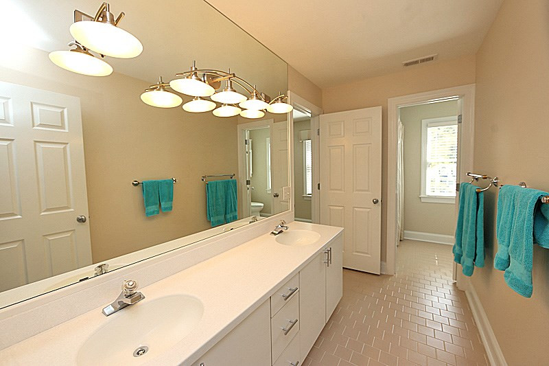 4310 Swarthmore Road Durham, NC 27707 - Photo 17 of 23 Adjacent to one of the secondary bathrooms and across the hall from the other. Double vanity, separate water closet and bathtub/shower. Bathroom