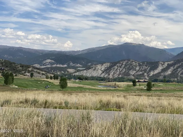 a view of a lake with a big yard