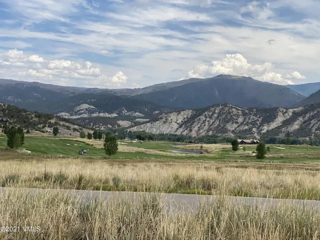 a view of a lake with a big yard