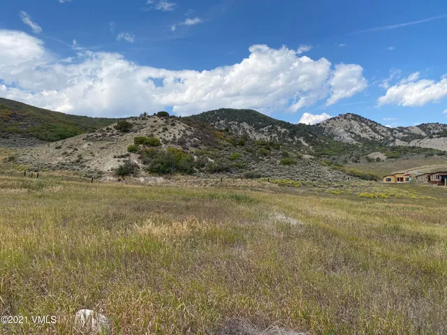 a view of mountain with sunset