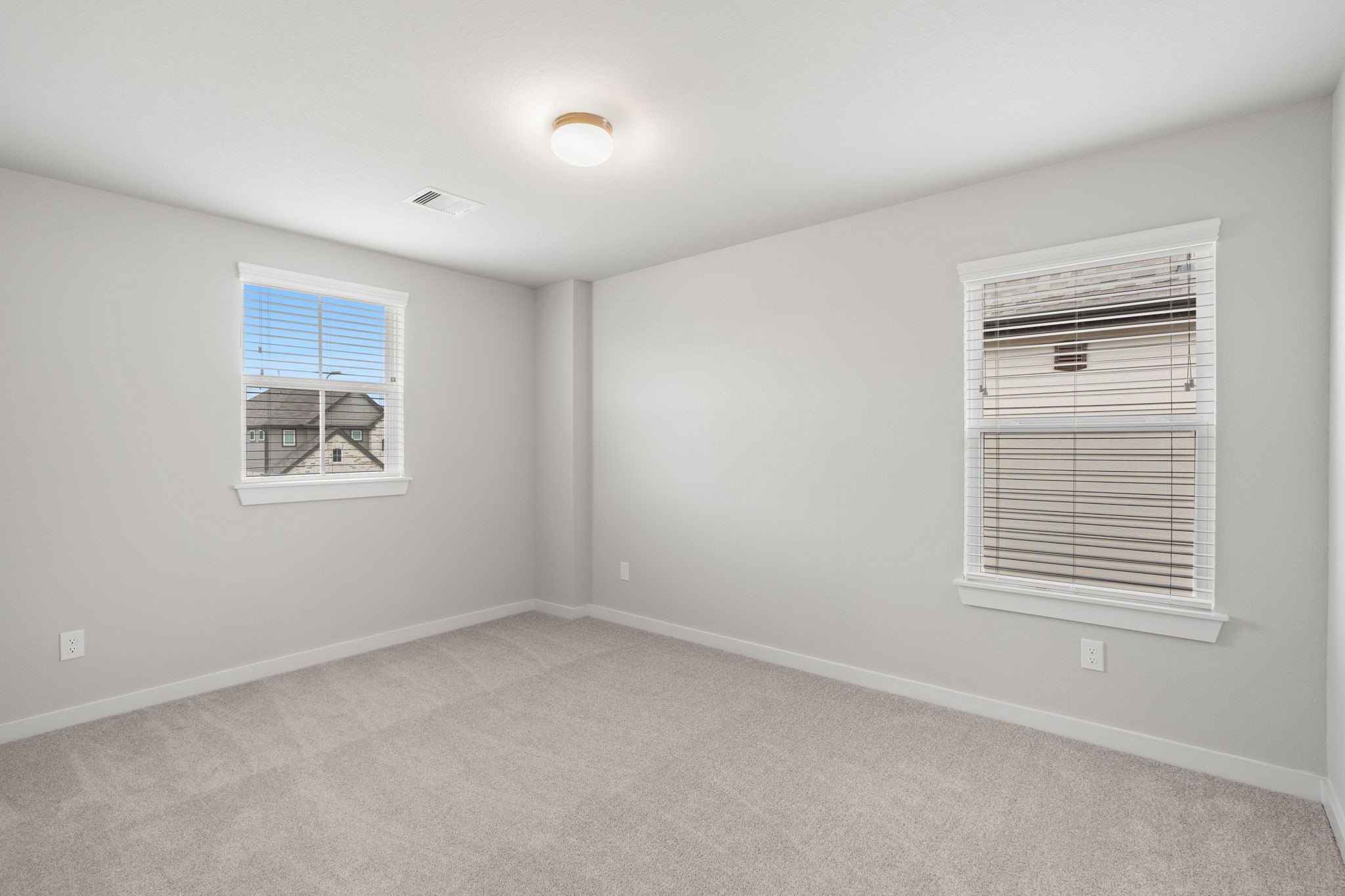 15203 Statice Trail Houston, TX 77044 - Photo 20 of 21 an empty room with windows and cabinet