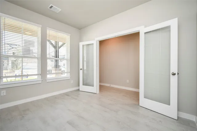 a view of a dining room with furniture and window