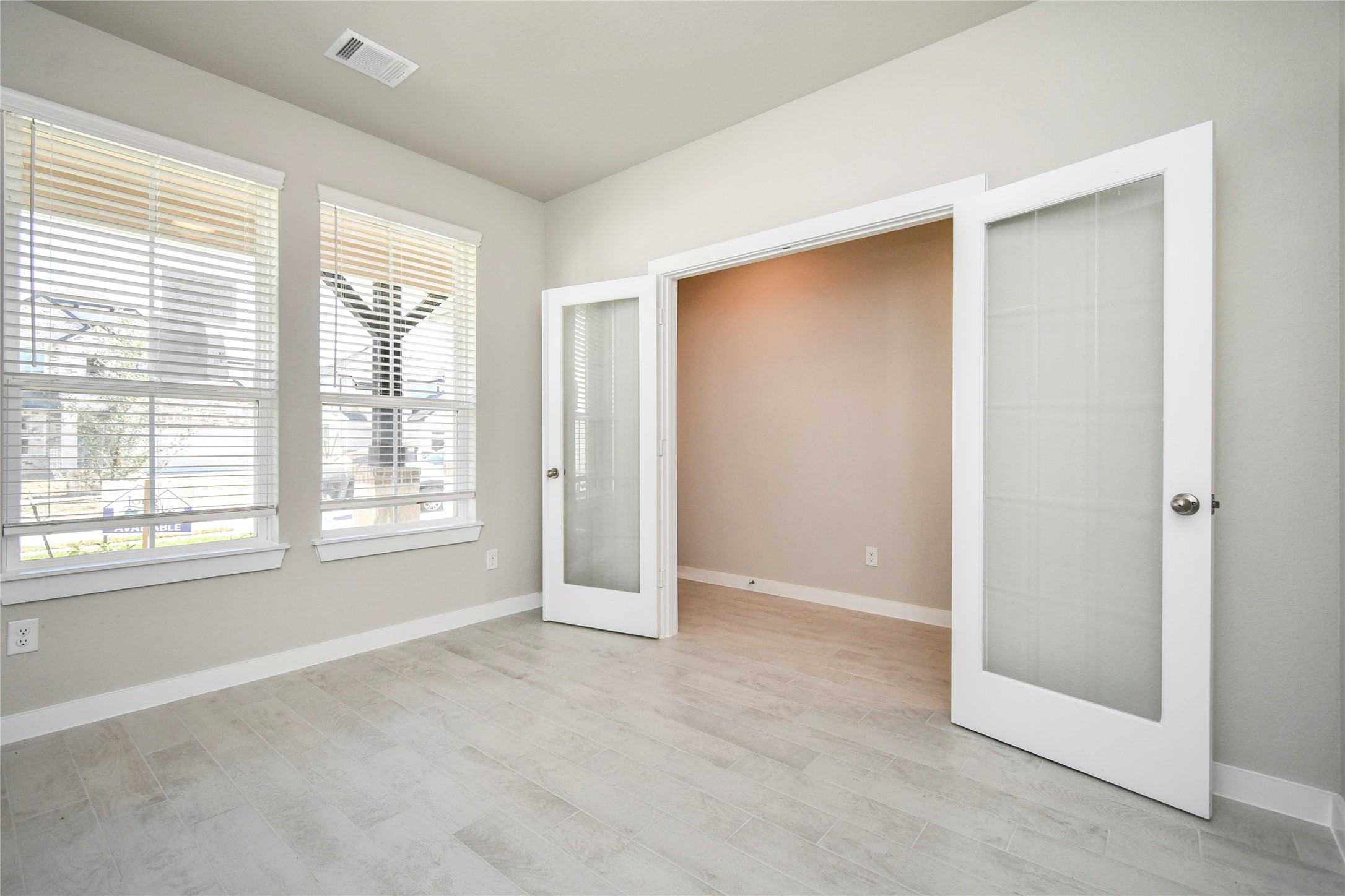 15203 Statice Trail Houston, TX 77044 - Photo 6 of 21 a view of an empty room with a window