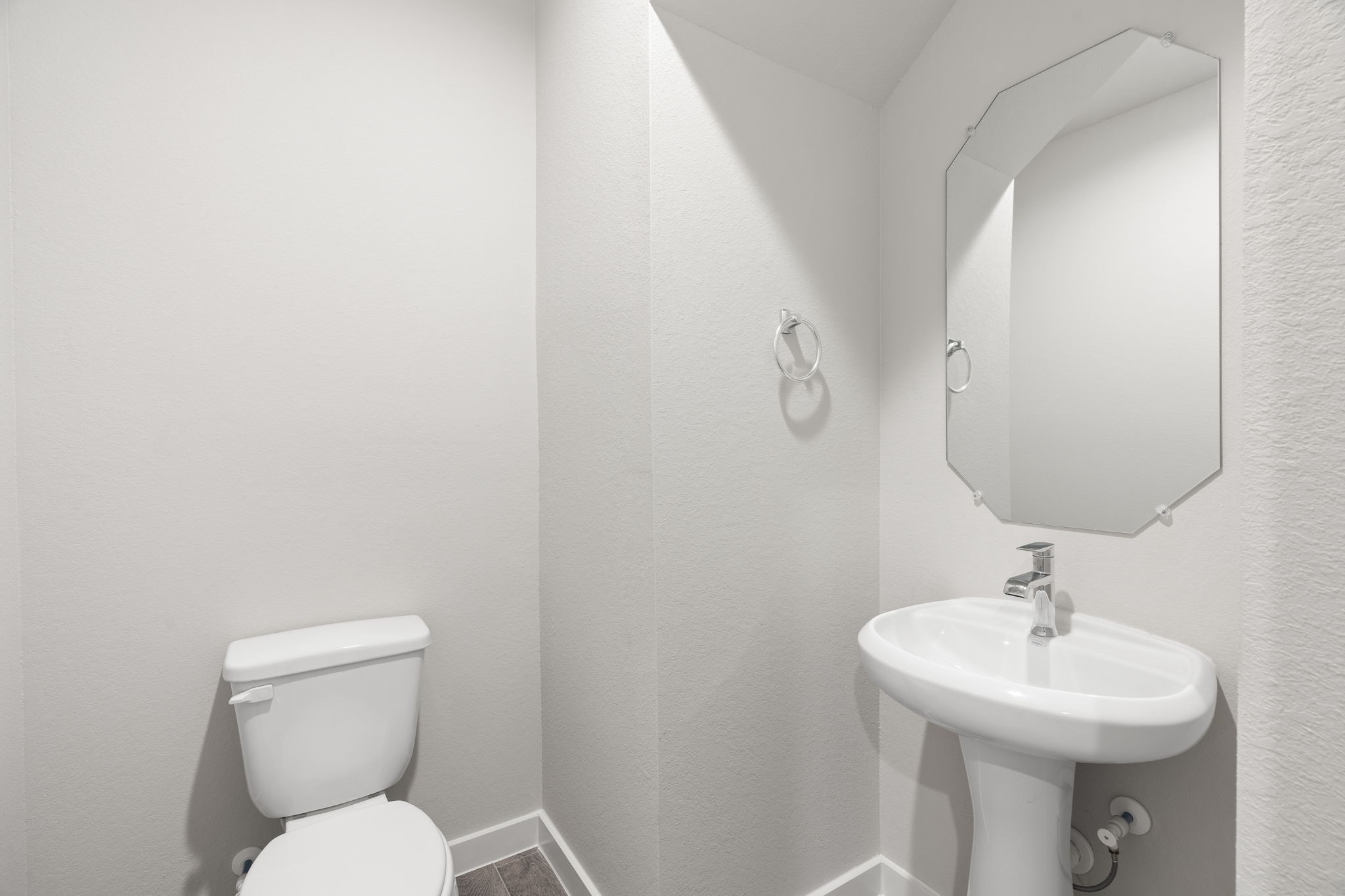15203 Statice Trail Houston, TX 77044 - Photo 7 of 21 a bathroom with a toilet sink and mirror