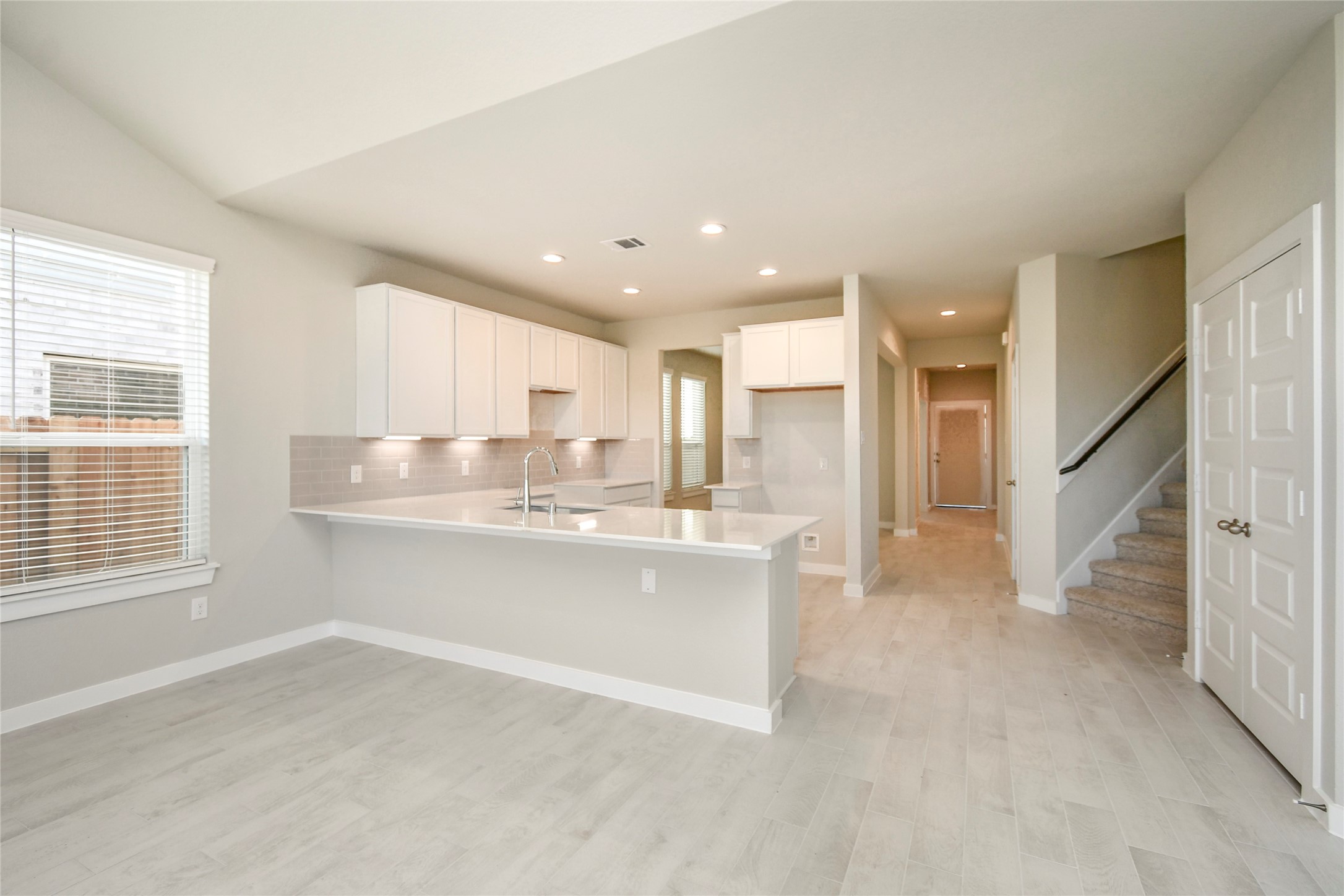 15203 Statice Trail Houston, TX 77044 - Photo 11 of 21 a view of kitchen with kitchen island sink and refrigerator