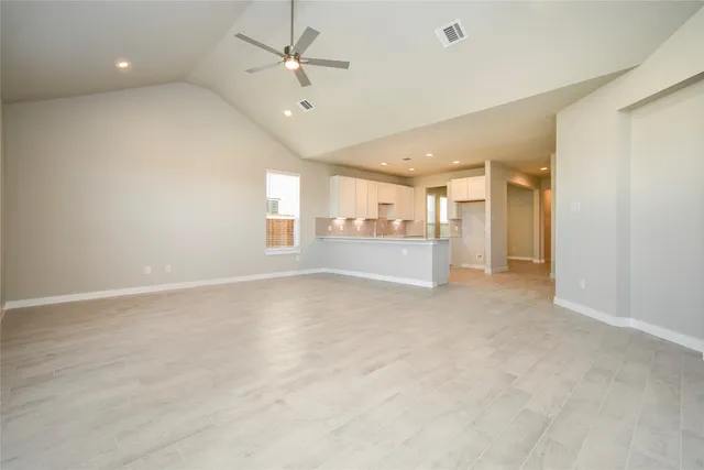 a spacious bedroom with a bed and a table