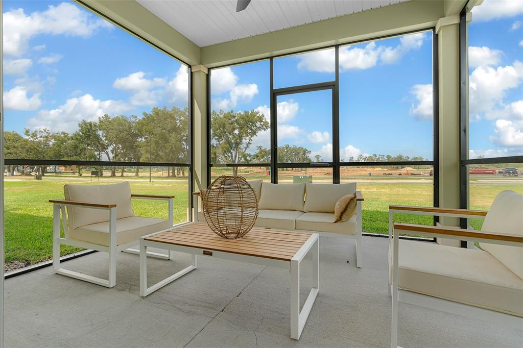 8772 Southwest 67th Circle Ocala, FL 34476 - Photo 2 of 3 a view of swimming pool with outdoor seating