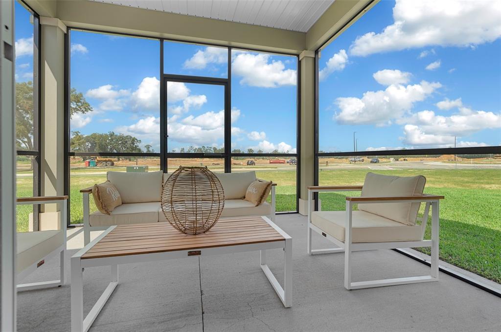 8772 Southwest 67th Circle Ocala, FL 34476 - Photo 3 of 3 a view of a swimming pool with outdoor seating