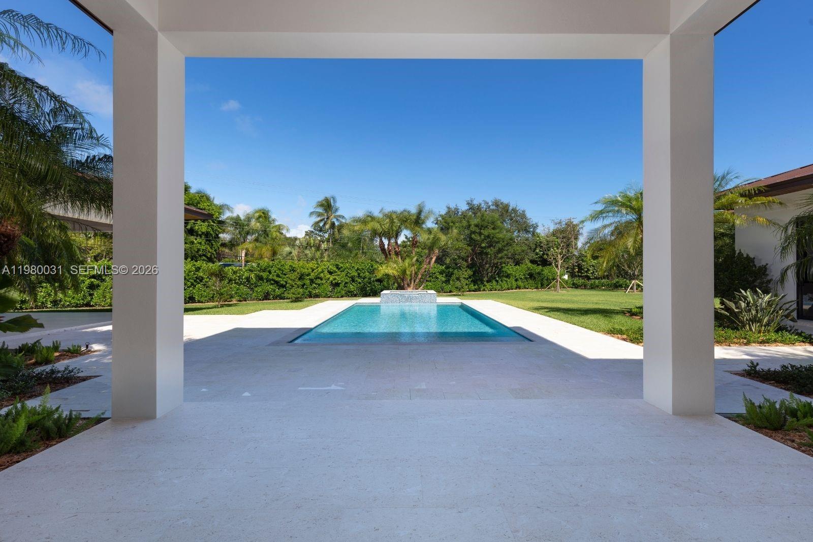 6065 Southwest 109th Street Pinecrest, FL 33156 - Photo 14 of 28 a view of a road with a yard