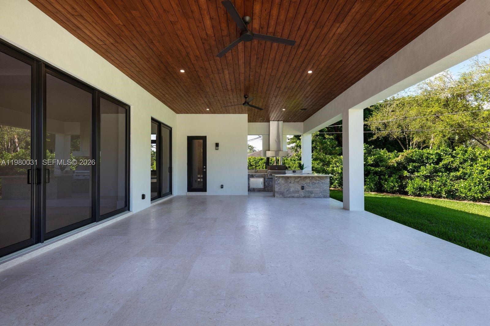 6065 Southwest 109th Street Pinecrest, FL 33156 - Photo 15 of 28 a view of a porch of a house
