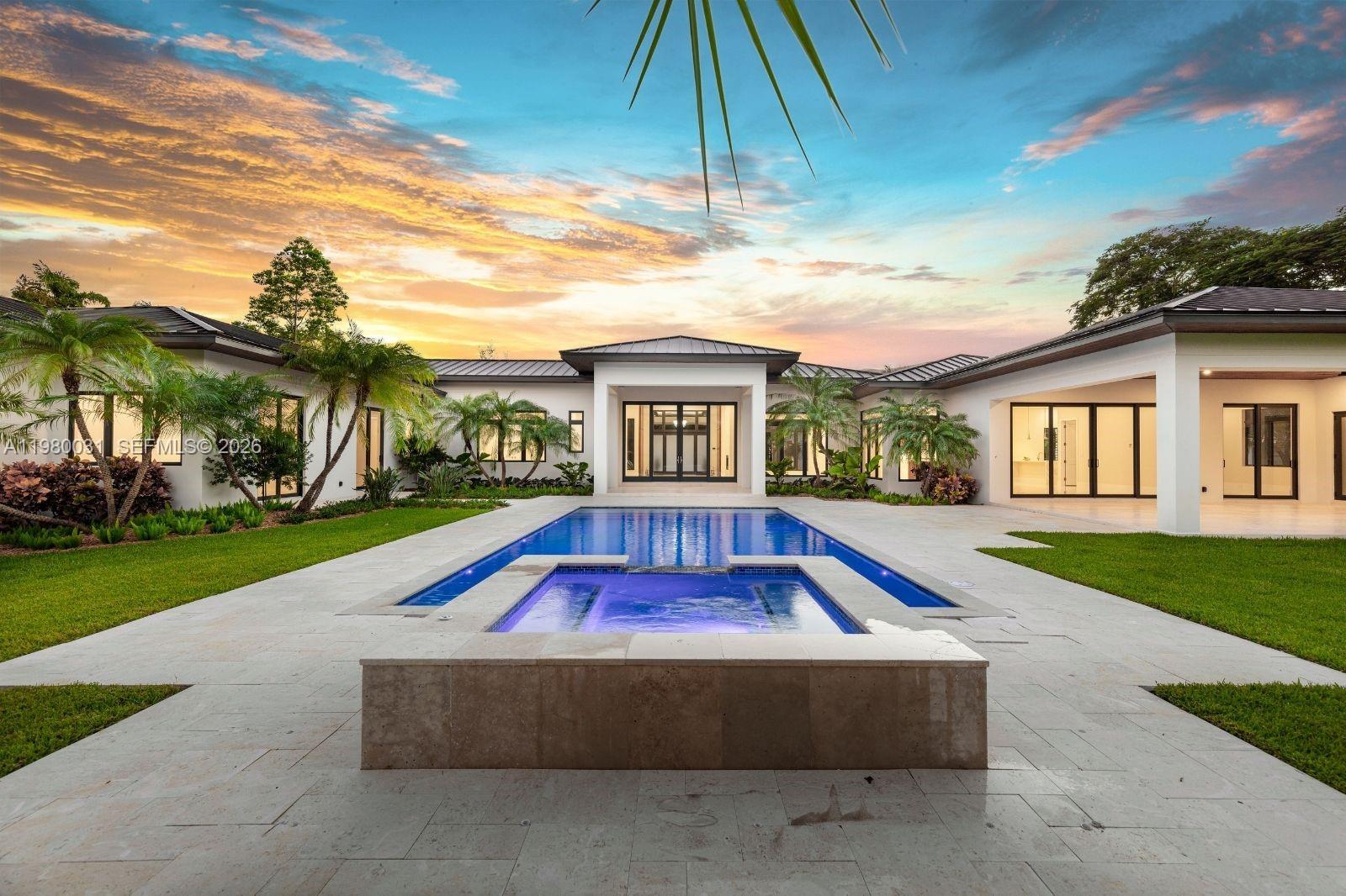 6065 Southwest 109th Street Pinecrest, FL 33156 - Photo 2 of 28 a view of backyard with a garden and entertaining space