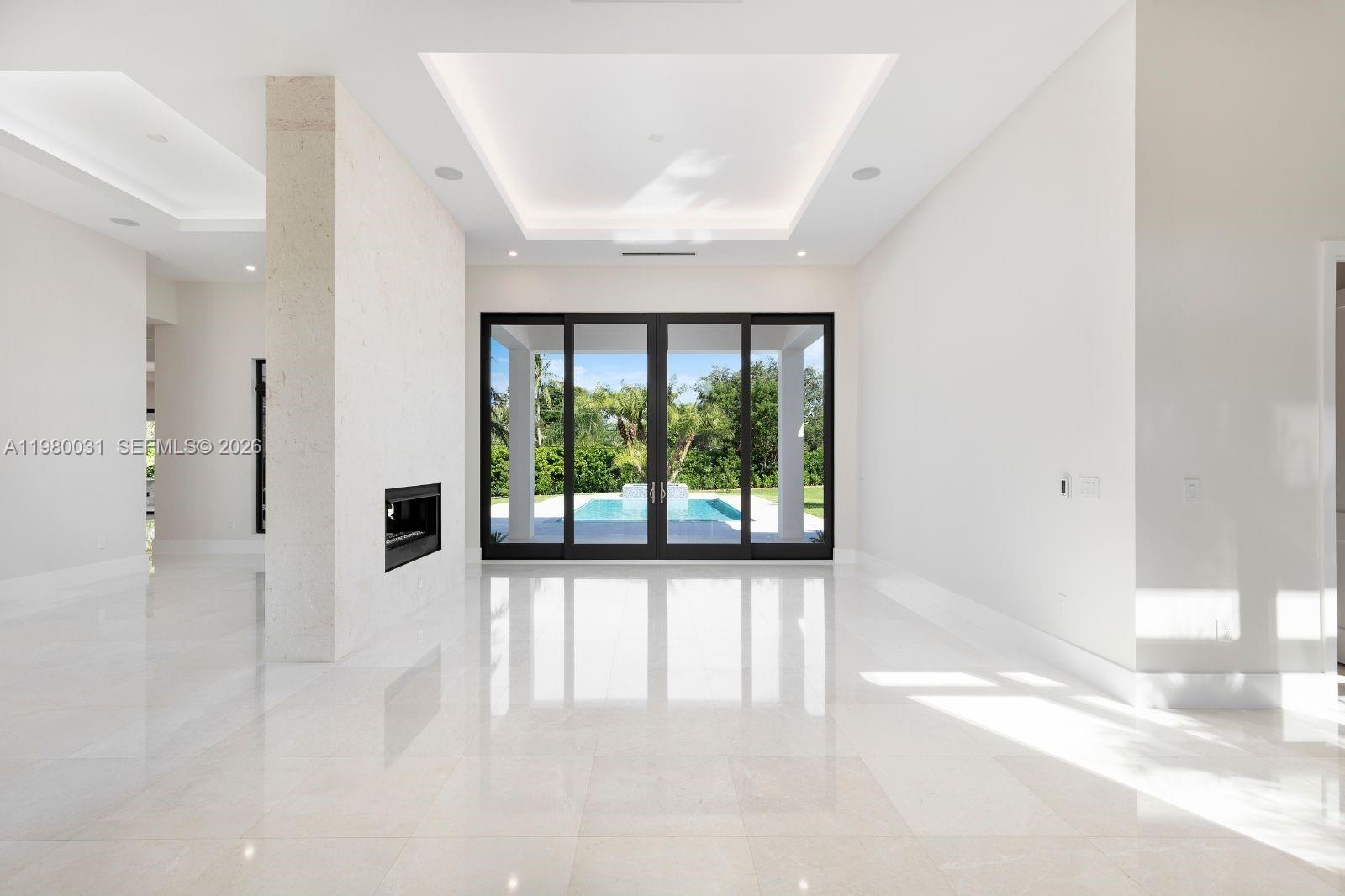 6065 Southwest 109th Street Pinecrest, FL 33156 - Photo 4 of 28 a view of a room with a large window